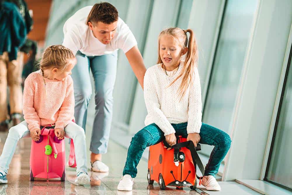 girls pull along suitcase